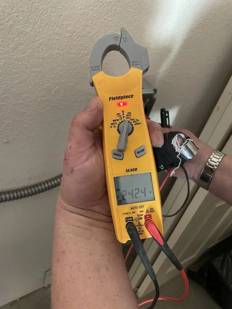 Voltage testing with clamp meter during Ceiling Fan Installation in Melrose